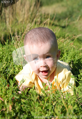 Image of happy smiling baby in grass