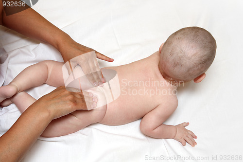 Image of small baby massaging