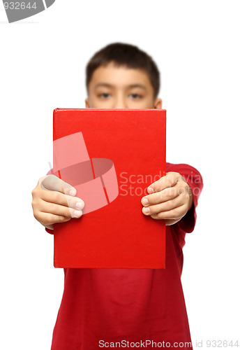 Image of asian boy showing big red book