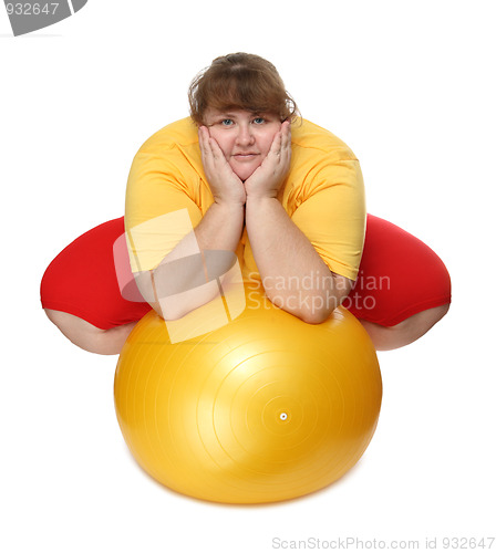 Image of overweight woman sitting with gym ball