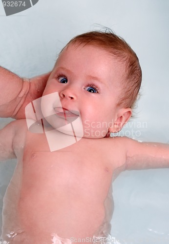 Image of baby girl showing tongue