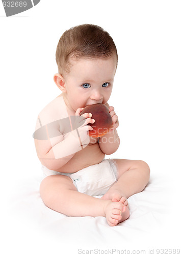 Image of baby eating peach