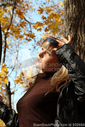 Image of beautiful girl on autumn background