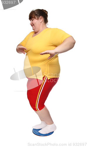 Image of overweight woman on gymnastic disc