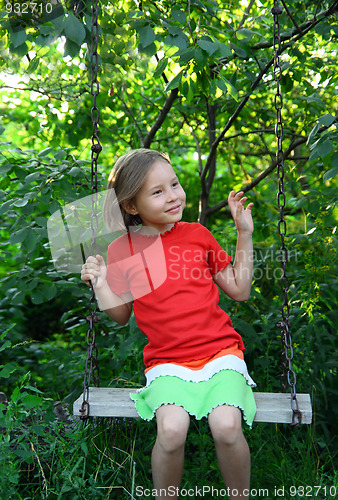 Image of happy girl on swing