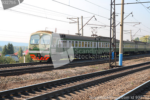 Image of passenger train on electric railway
