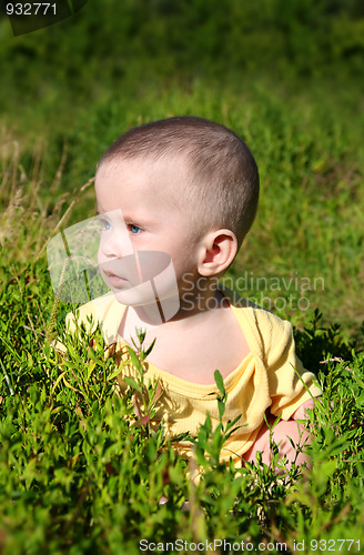 Image of baby sitting in grass