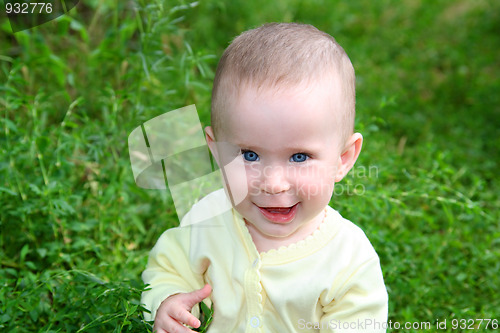Image of happy smiling baby in grass