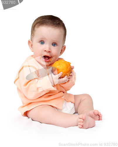 Image of baby eating peach