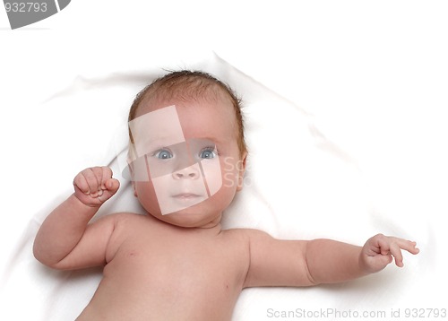 Image of baby on white sheet