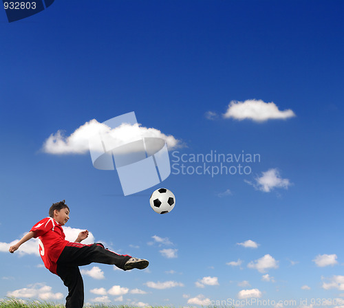Image of asian boy playing football