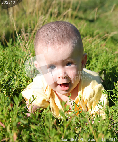 Image of happy smiling baby in grass