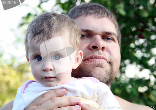 Image of baby daughter and father