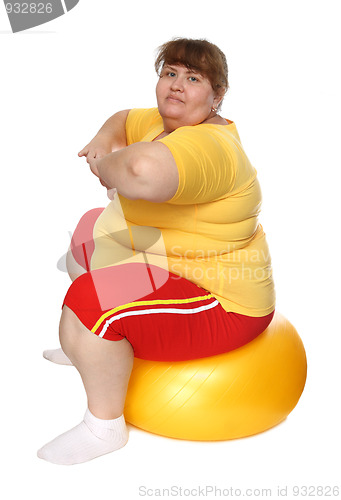 Image of exercising overweight woman on ball