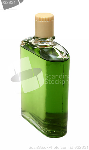 Image of old bottle with green cologne