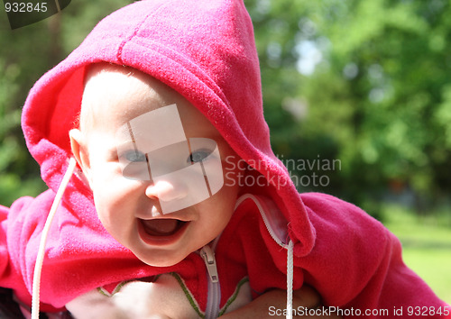 Image of happy laughing baby outdoors