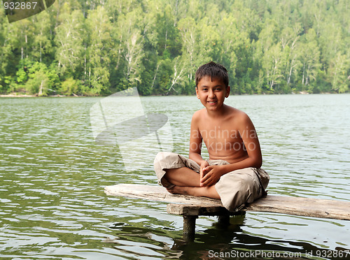 Image of boy sitting on stage