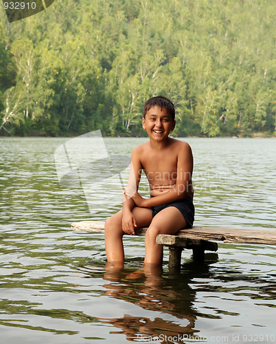 Image of boy sitting on stage