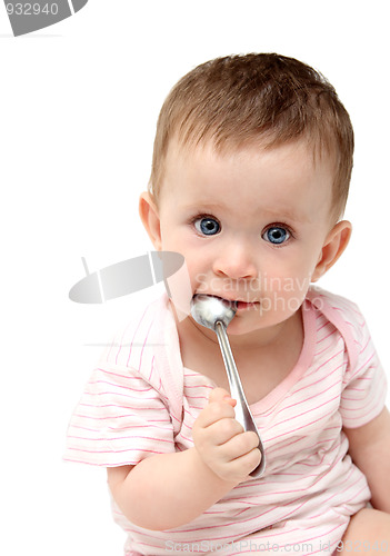 Image of lbaby sucking spoon