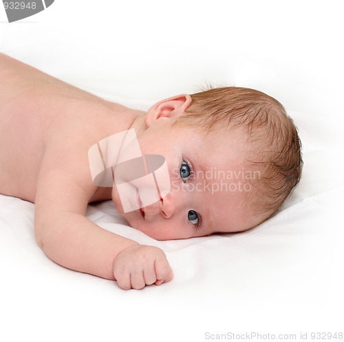 Image of baby crawling on white sheet