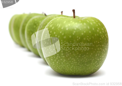 Image of green apples in row