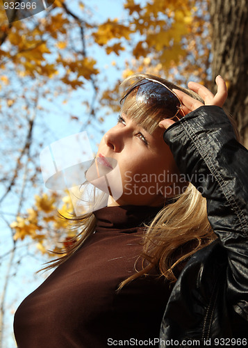 Image of beautiful girl on autumn background