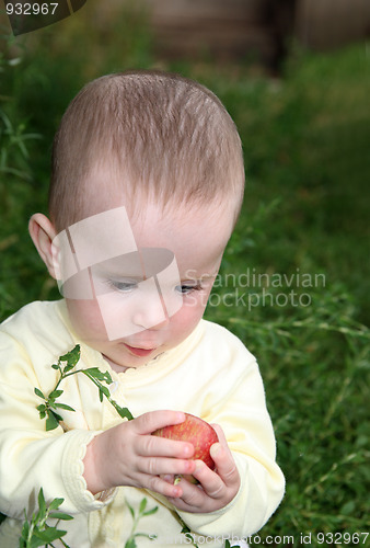 Image of small baby holding apple