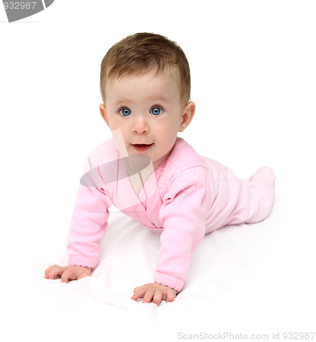 Image of baby in pink on white sheet