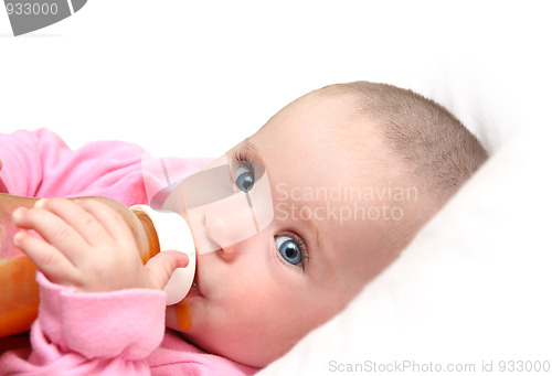 Image of baby drinking juice form bottle