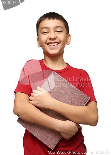 Image of smiling asian boy holding big book