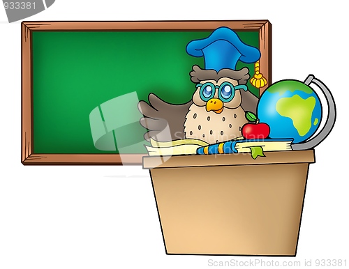 Image of Owl teacher behind desk