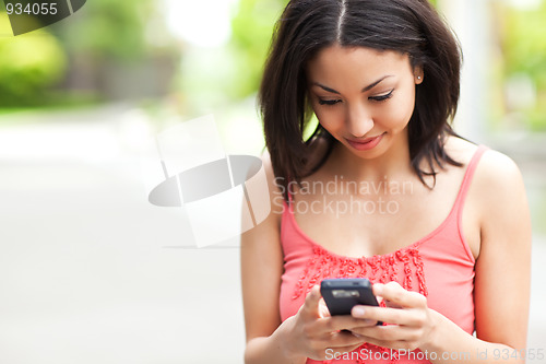 Image of Woman texting