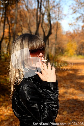 Image of young girl with cigarette