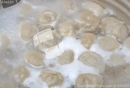 Image of russian pelmeni boiling in pot