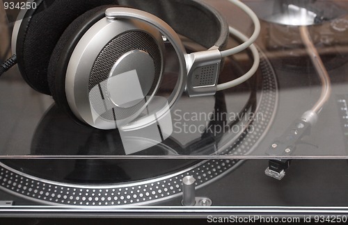 Image of headphones on gramophone disc player