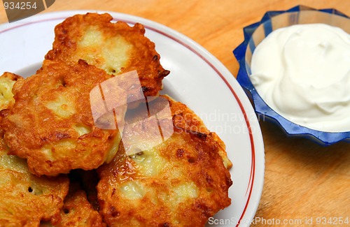 Image of potato pancakes with sour cream