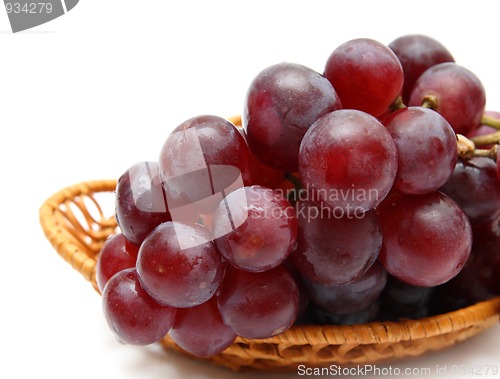 Image of wet grape berry bunch in basket