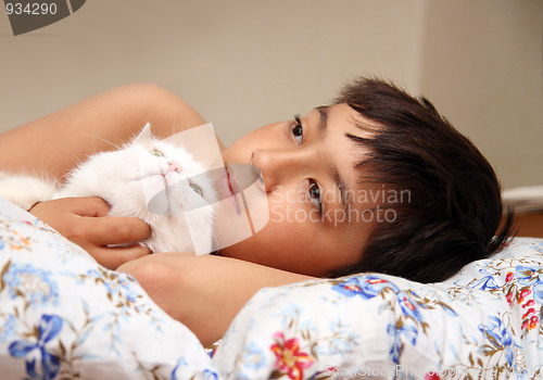 Image of boy with white cat