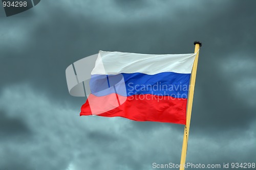 Image of russian flag on storm-clouds background