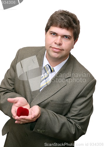 Image of businessman gifting heart