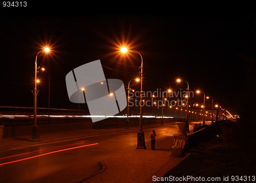 Image of night road through bridge