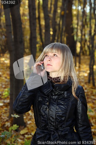 Image of young woman talking by phone