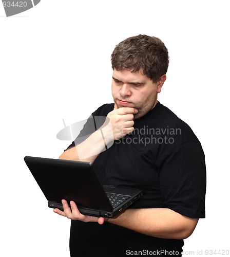 Image of thinking man with laptop