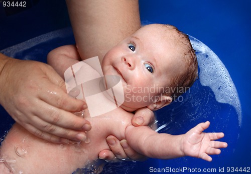 Image of newborn baby in bathtub