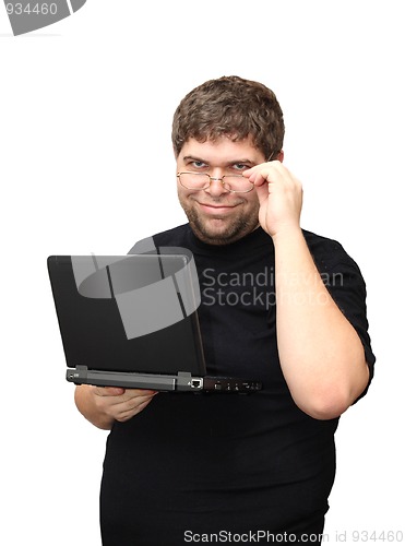 Image of man standing with laptop