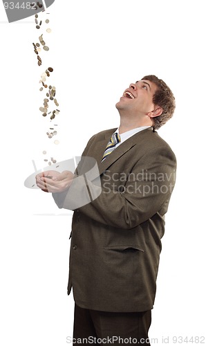 Image of businessman catching falling money