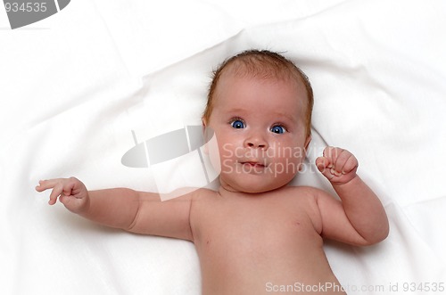 Image of baby on white sheet