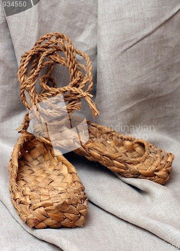 Image of russian bast shoes on canvas