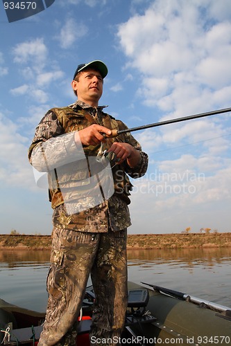 Image of boy fishing with spinning