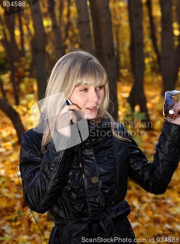 Image of young woman talking by phone